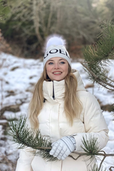 a lady wears a white goose down jacket